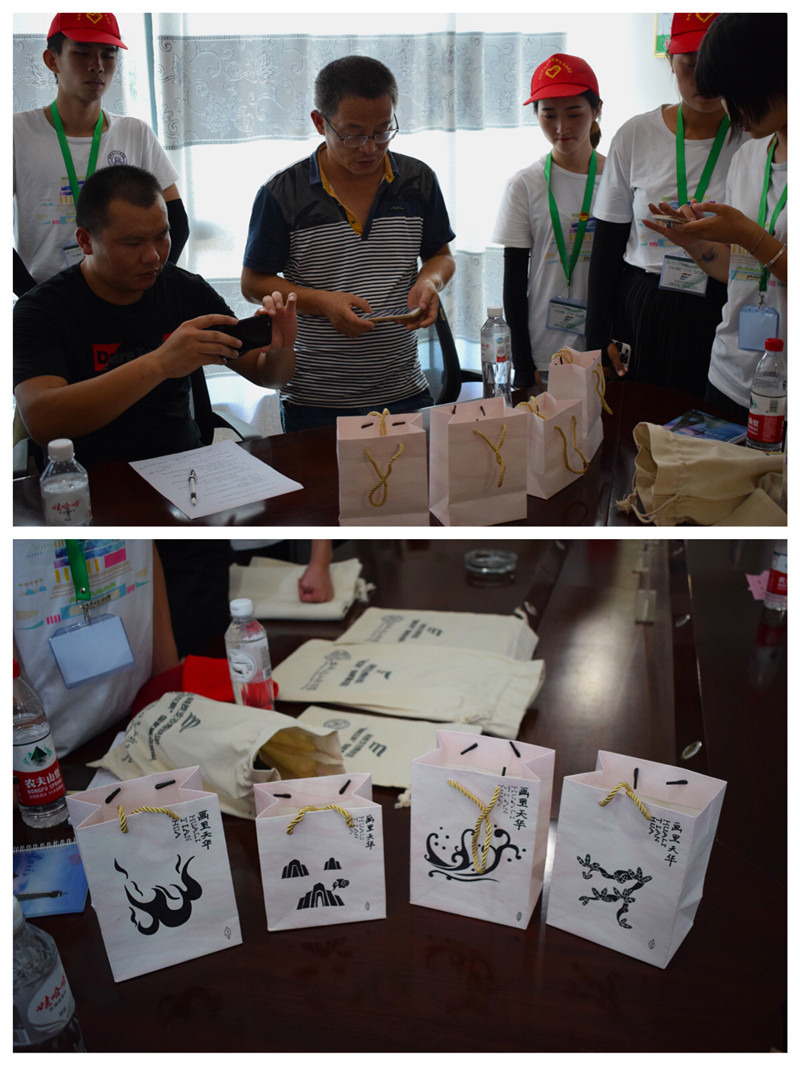 3.图为队员为当地领导及农民展示手绘的茶叶外观设计包装.jpg